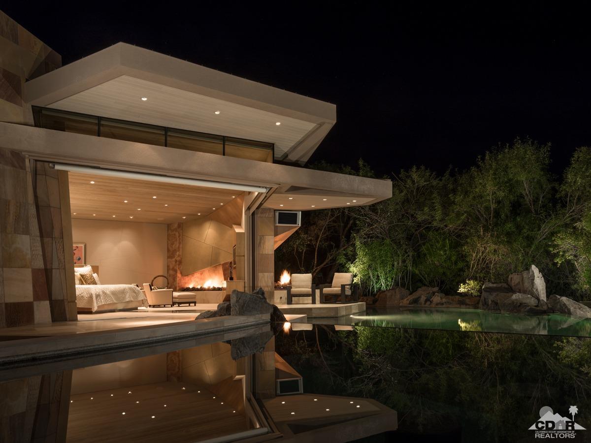 632 Pinnacle Crest Palm Desert, CA 92260 - Photo 19 of 52 a view of a patio with table and chairs with plants