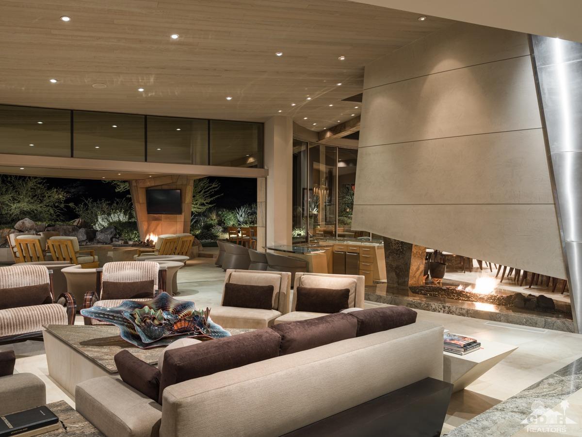 632 Pinnacle Crest Palm Desert, CA 92260 - Photo 22 of 52 a living room with furniture and a table