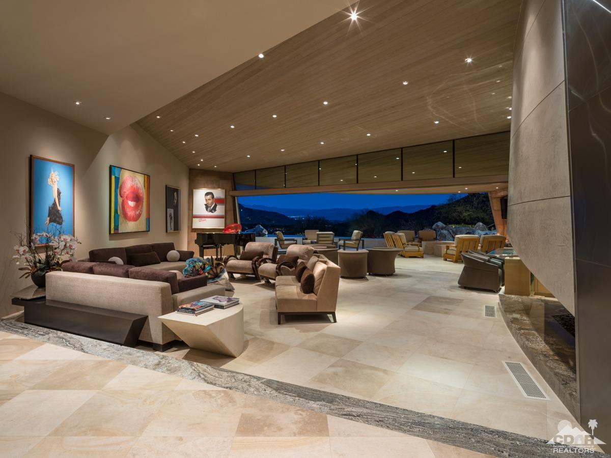 632 Pinnacle Crest Palm Desert, CA 92260 - Photo 24 of 52 a living room with furniture and a fireplace