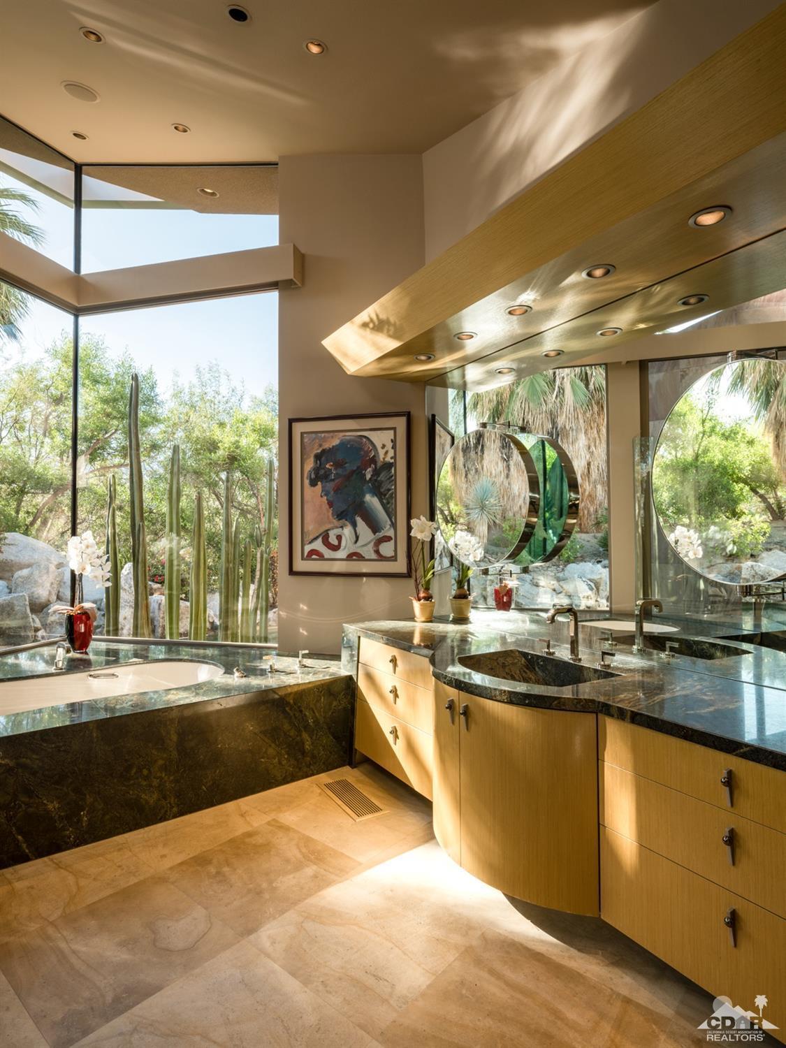 632 Pinnacle Crest Palm Desert, CA 92260 - Photo 34 of 52 a large kitchen with kitchen island a large window in it