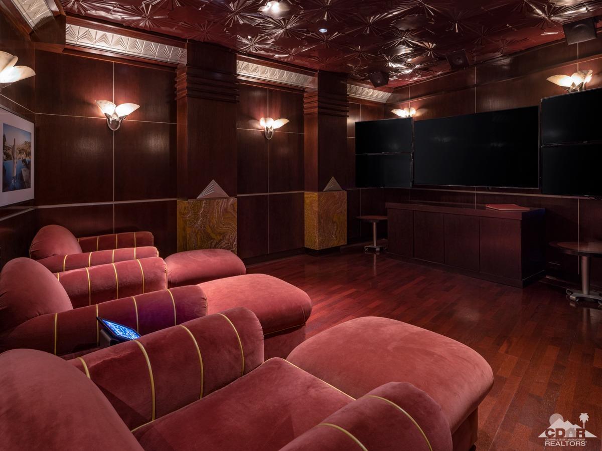 632 Pinnacle Crest Palm Desert, CA 92260 - Photo 39 of 52 a media room with lots of chairs and a projector