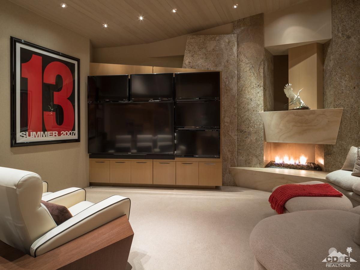 632 Pinnacle Crest Palm Desert, CA 92260 - Photo 40 of 52 a living room with furniture and a fireplace