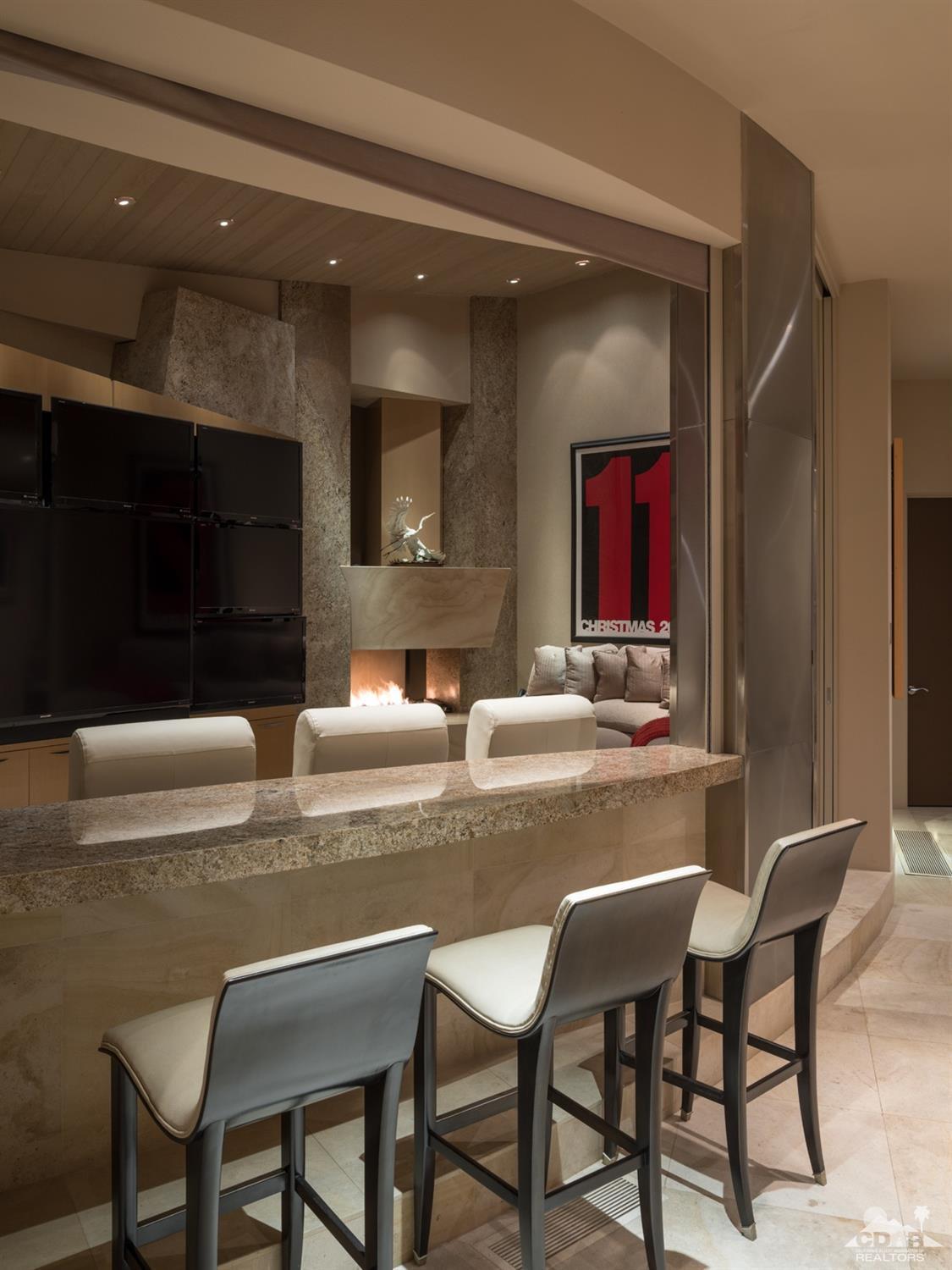 632 Pinnacle Crest Palm Desert, CA 92260 - Photo 41 of 52 a dining hall with granite countertop a couch and chairs