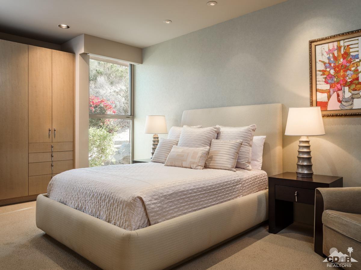 632 Pinnacle Crest Palm Desert, CA 92260 - Photo 43 of 52 a bedroom with a bed and a large window