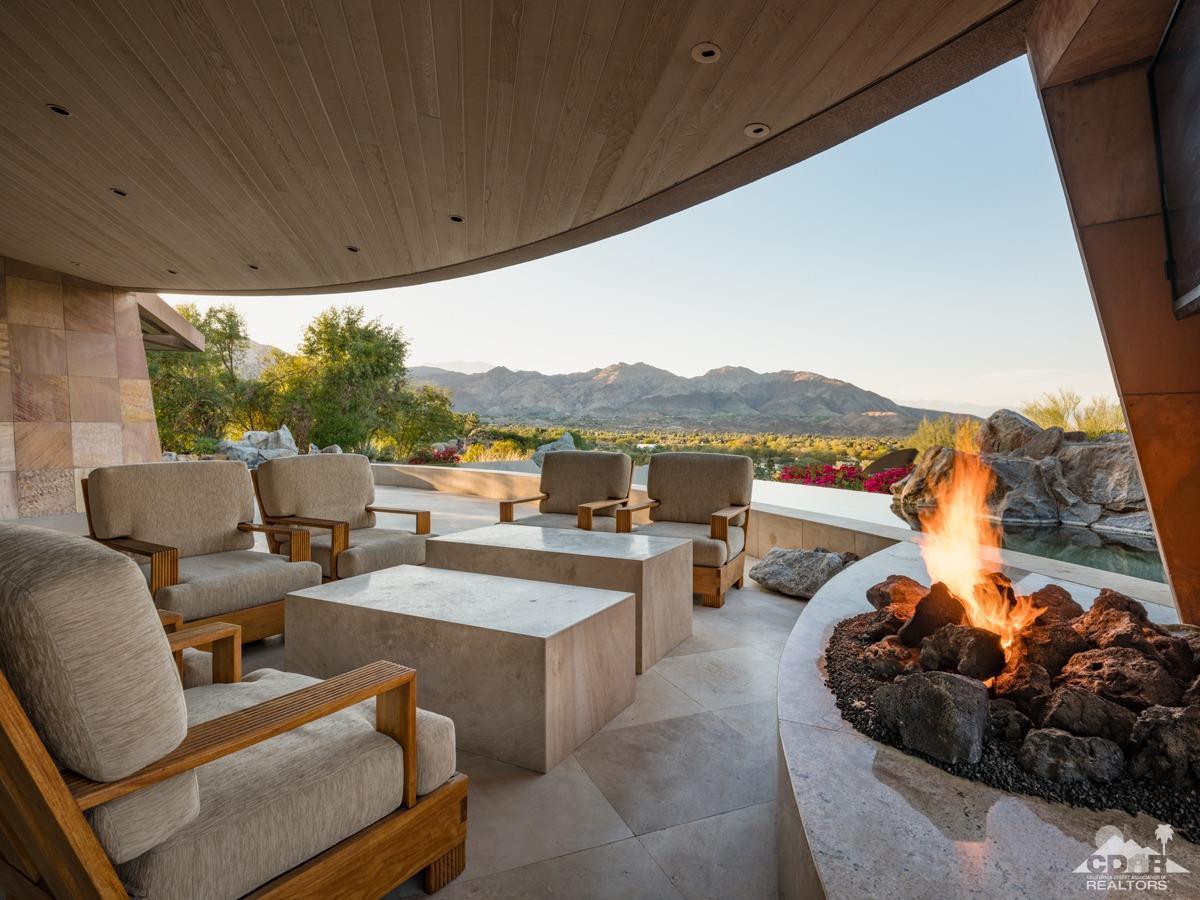 632 Pinnacle Crest Palm Desert, CA 92260 - Photo 46 of 52 a view of a patio with couches chairs and a potted plant