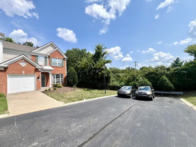 a view of street with parked cars