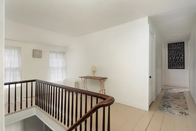 a view of a hallway with staircase