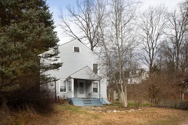 a front view of a house with yard