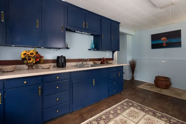 a kitchen with stainless steel appliances granite countertop a sink dishwasher stove and cabinets