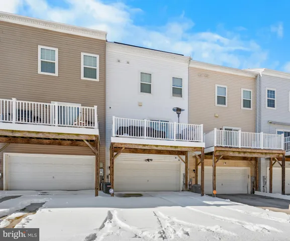 a kitchen with stainless steel appliances granite countertop a refrigerator and stove