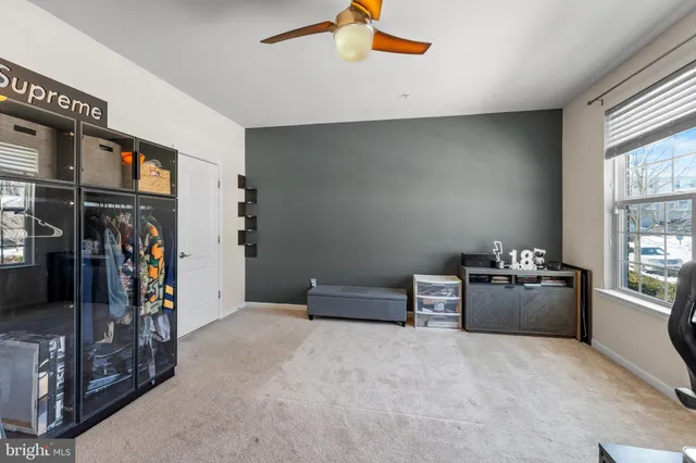 a view of a livingroom with furniture and windows