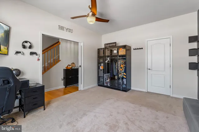 a view of a workspace with furniture and closet