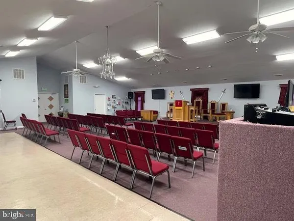 a living room with lots of furniture and a chandelier