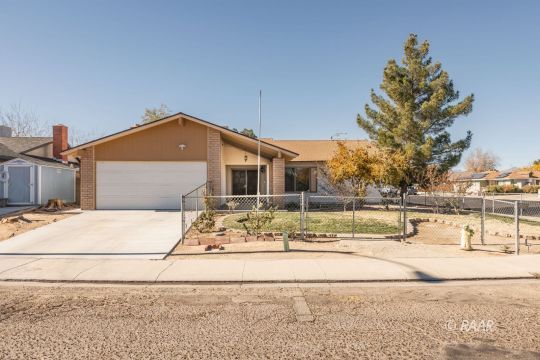 437 Peg Street Ridgecrest, CA 93555 - Photo 1 of 35 a view of a house with snow on the road