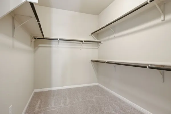 a view of an empty walk in closet