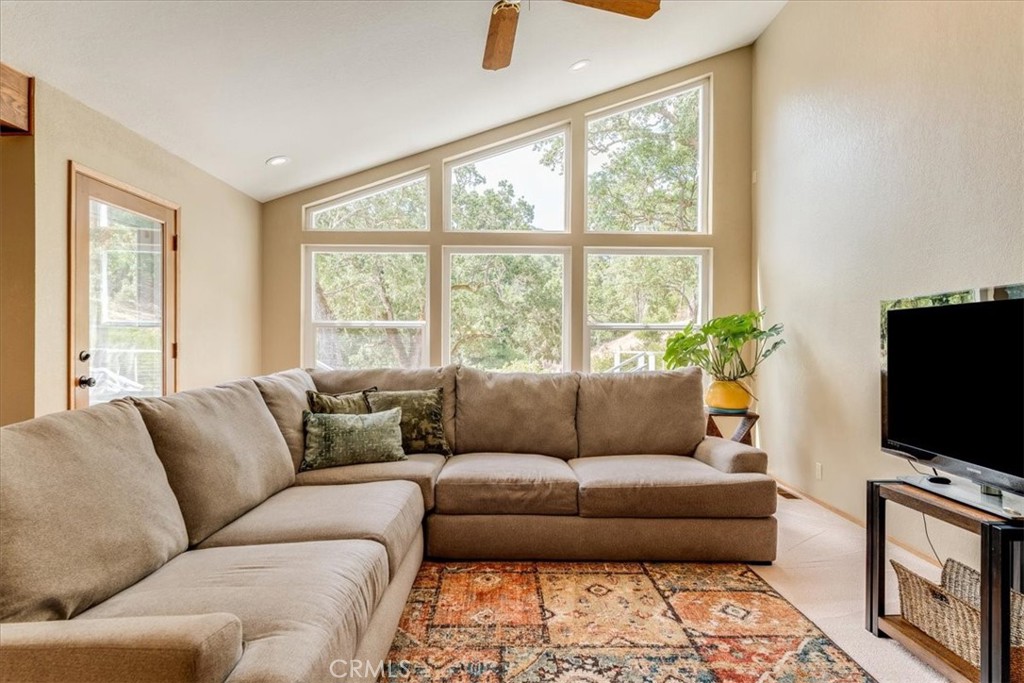 11555 Cenegal Road Atascadero, CA 93422 - Photo 13 of 57 a living room with furniture and a flat screen tv