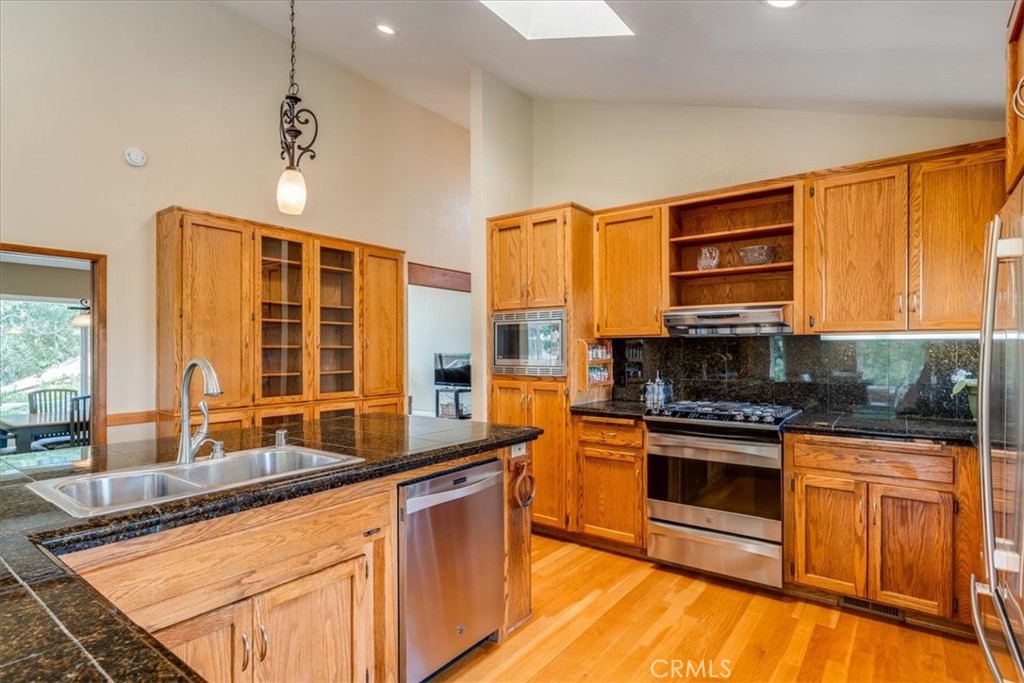 11555 Cenegal Road Atascadero, CA 93422 - Photo 15 of 57 a kitchen with stainless steel appliances granite countertop a stove a sink and a microwave