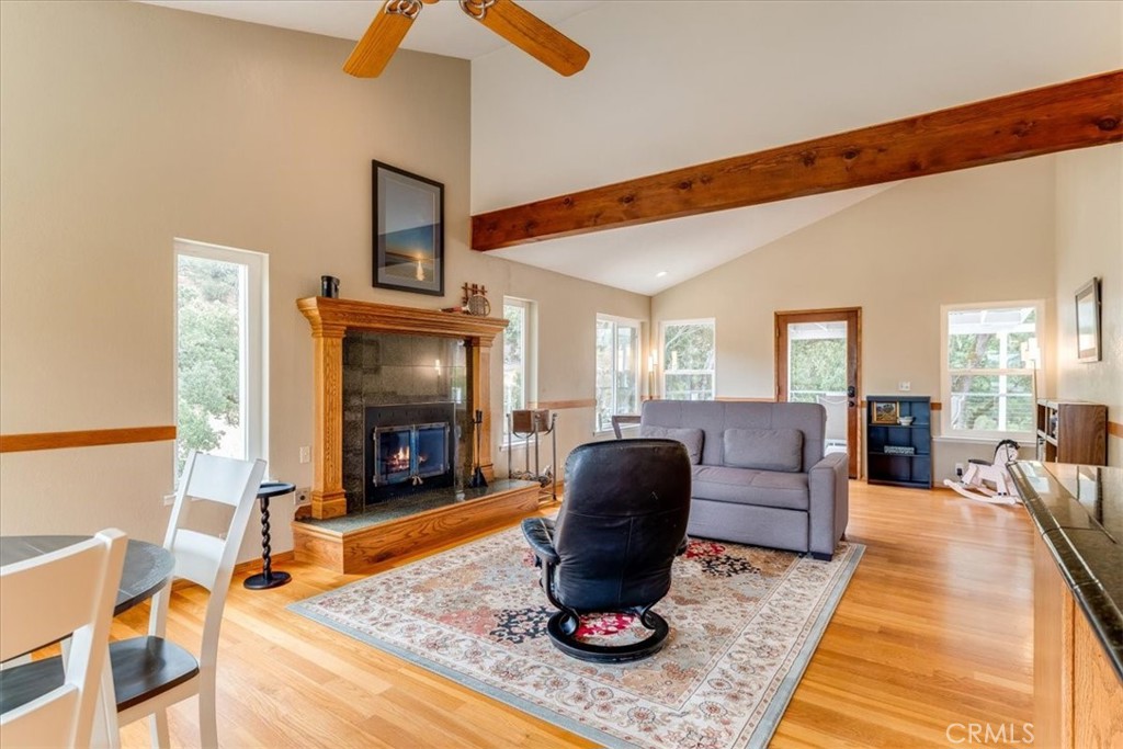 11555 Cenegal Road Atascadero, CA 93422 - Photo 18 of 57 a living room with furniture a fireplace and a flat screen tv
