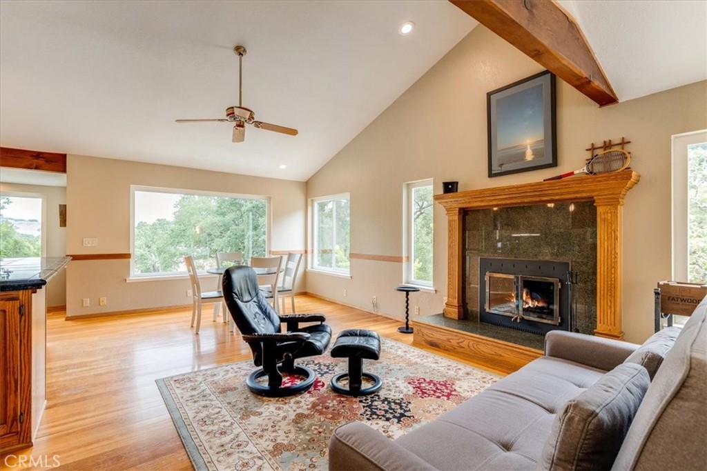 11555 Cenegal Road Atascadero, CA 93422 - Photo 20 of 57 a living room with furniture a fireplace and next to a window
