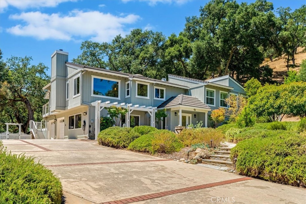 11555 Cenegal Road Atascadero, CA 93422 - Photo 3 of 57 a front view of a house with a garden