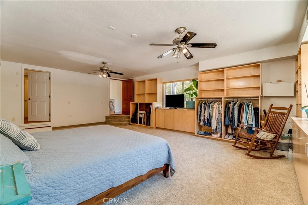 11555 Cenegal Road Atascadero, CA 93422 - Photo 38 of 57 a bed room with a bed and a walk in closet