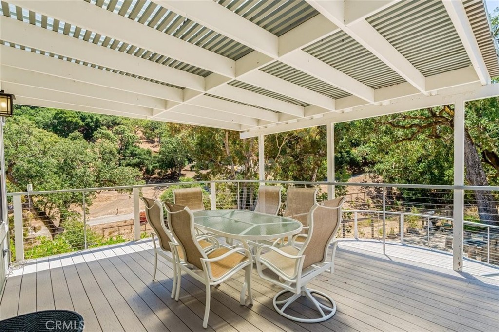 11555 Cenegal Road Atascadero, CA 93422 - Photo 44 of 57 a view of a patio with table and chairs and wooden floor