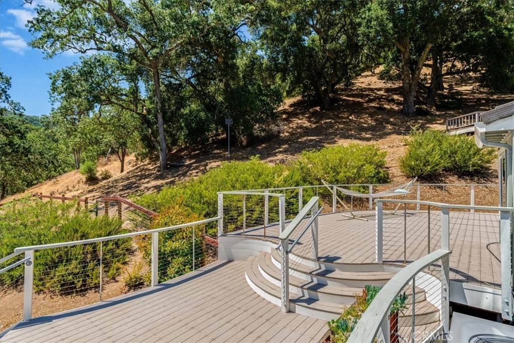 11555 Cenegal Road Atascadero, CA 93422 - Photo 46 of 57 a view of a balcony with wooden floor and outdoor seating