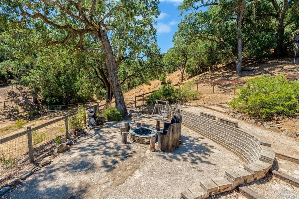 11555 Cenegal Road Atascadero, CA 93422 - Photo 54 of 57 a view of a patio with table and chairs and wooden fence