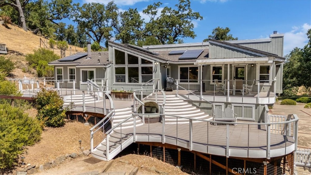 11555 Cenegal Road Atascadero, CA 93422 - Photo 6 of 57 a view of a white house with large windows and couches