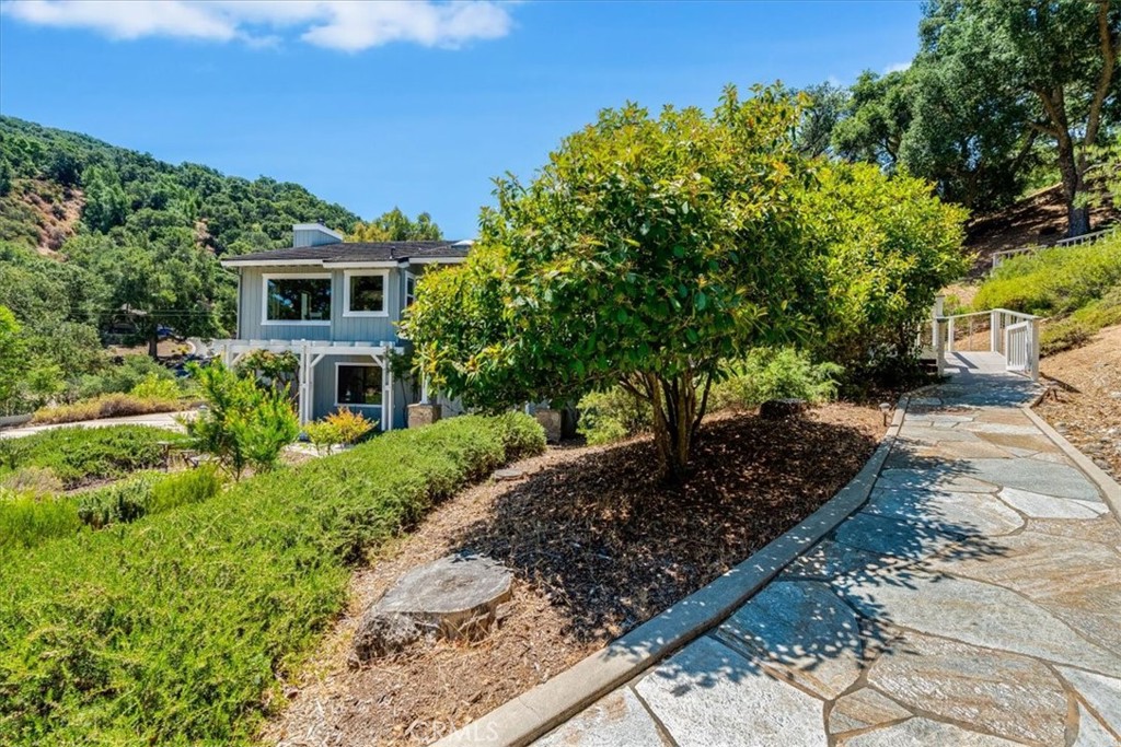 11555 Cenegal Road Atascadero, CA 93422 - Photo 8 of 57 a front view of a house with a yard