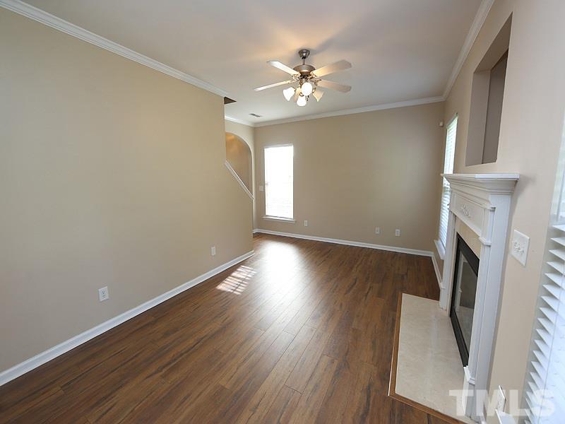 8336 Tie Stone Way Raleigh, NC 27613 - Photo 6 of 20 a view of livingroom with furniture wooden floor and fan