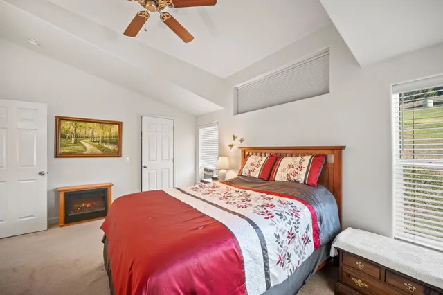 a bedroom with a bed and a couch