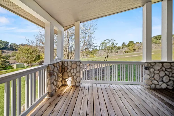a view of balcony with wooden floor