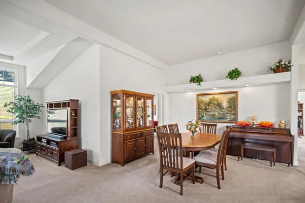 a dining room with furniture and window