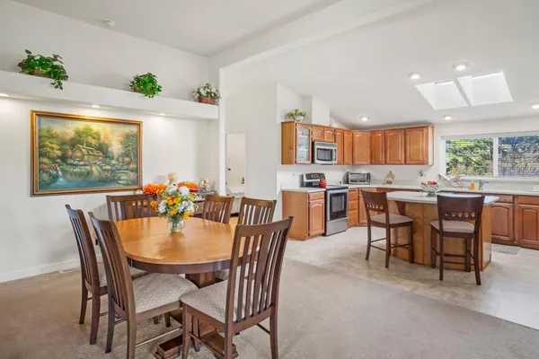 a view of a dining room with furniture window and outside view