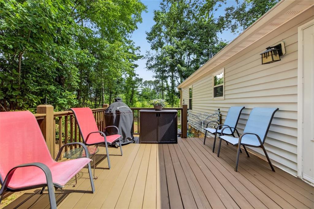 3771 Castleberry Road Cumming, GA 30040 - Photo 42 of 69 a patio with wooden cabinets and outdoor seating
