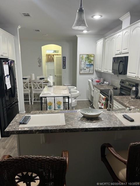 4191 2nd Court Lantana, FL 33462 - Photo 5 of 12 a large kitchen with lots of counter space and breakfast area