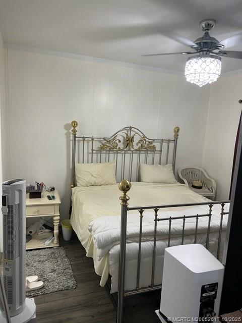 4191 2nd Court Lantana, FL 33462 - Photo 10 of 12 a bedroom with furniture and a chandelier