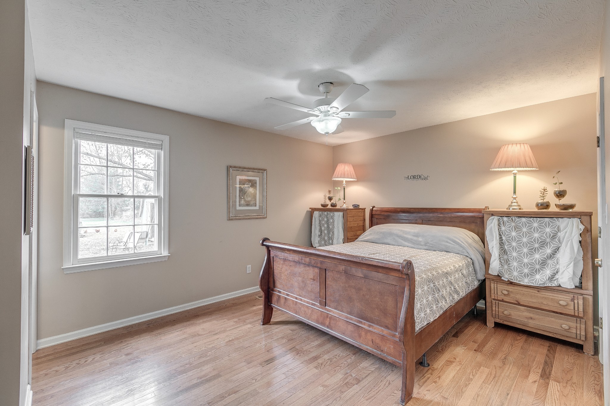 3385 Ridgefield Drive Murfreesboro, TN 37129 - Photo 11 of 25 a spacious bedroom with a bed chandelier and a window