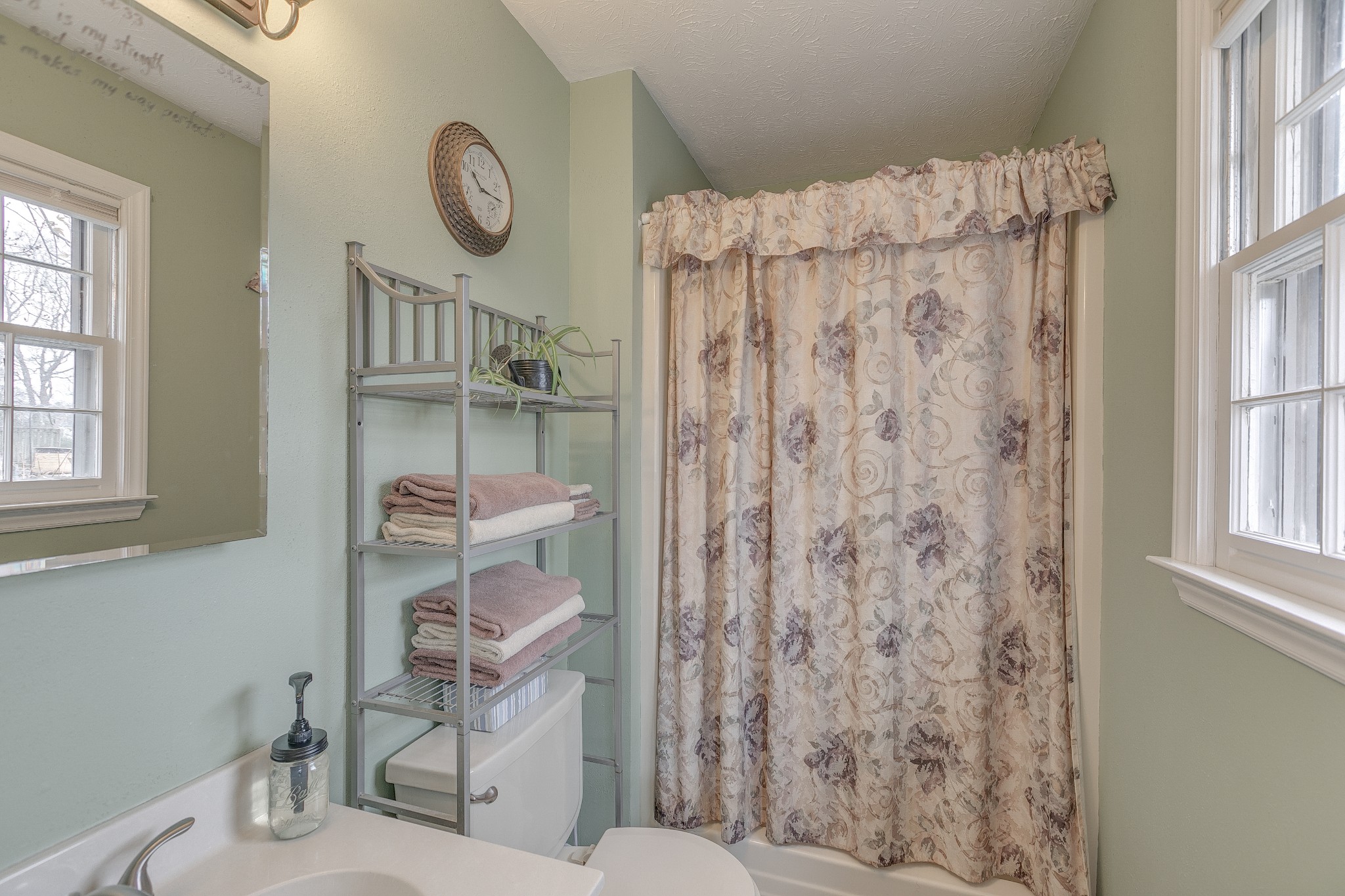3385 Ridgefield Drive Murfreesboro, TN 37129 - Photo 12 of 25 a bathroom with a shower curtain and a toilet