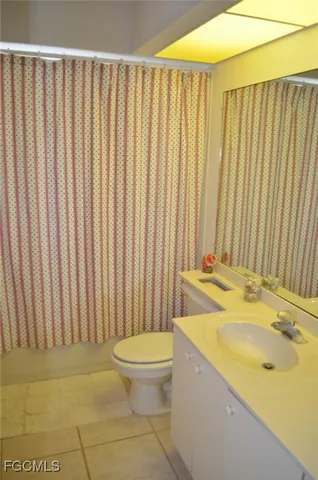 a bathroom with a sink a toilet and tub