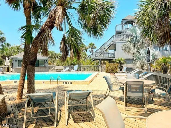 a view of a swimming pool with chairs