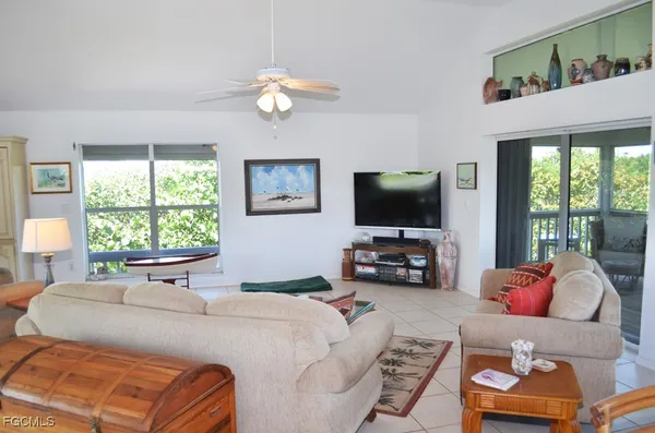 a bedroom with furniture and a flat screen tv