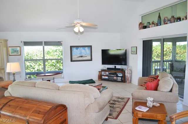 a bedroom with furniture and a flat screen tv