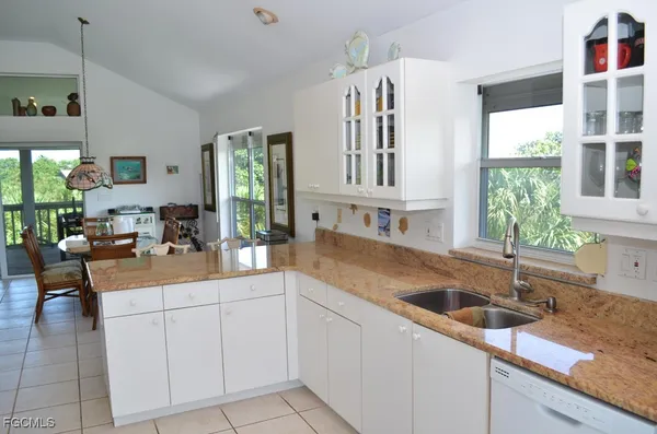 a kitchen with a sink and cabinets