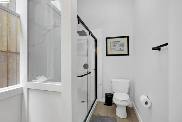 a kitchen with a stove a sink and a window