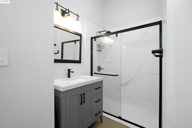 a kitchen with stainless steel appliances granite countertop a sink a stove a refrigerator cabinets and dining table