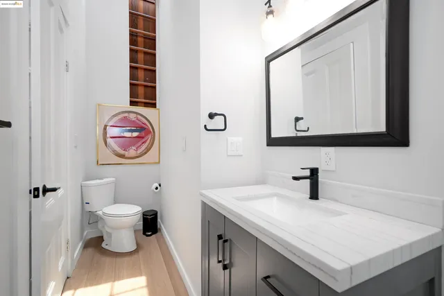 a kitchen with stainless steel appliances a sink stove and microwave