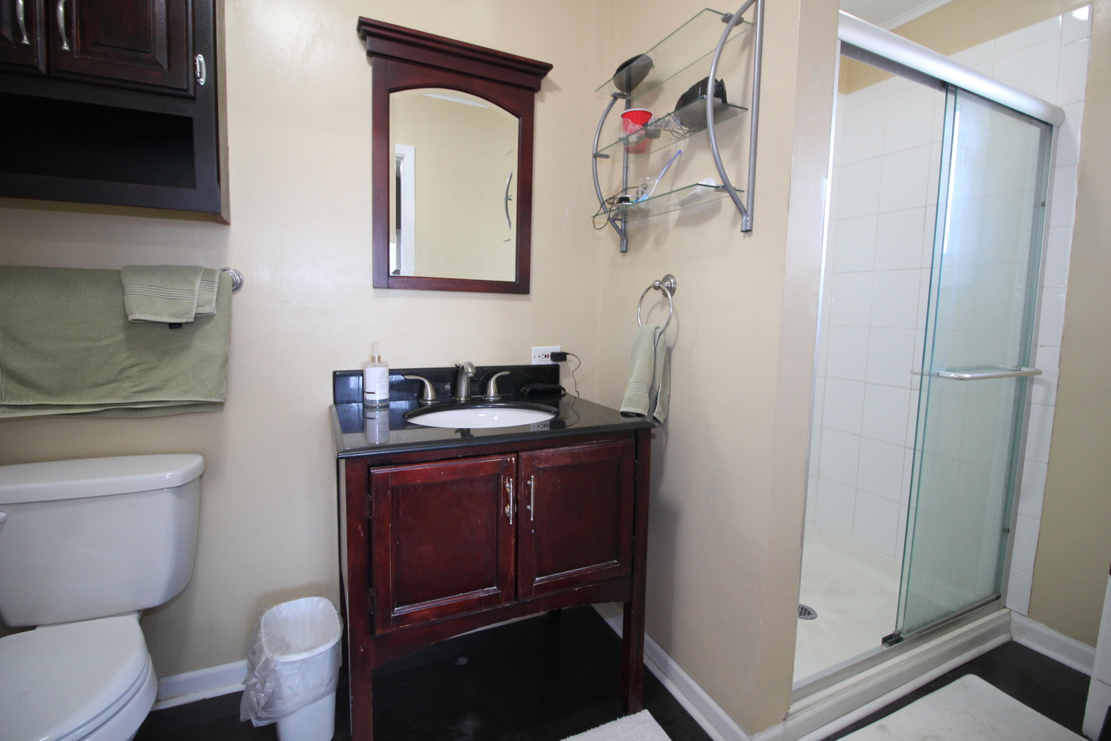 8001 South Kilpatrick Avenue Chicago, IL 60652 - Photo 16 of 25 a bathroom with a sink vanity mirror and toilet