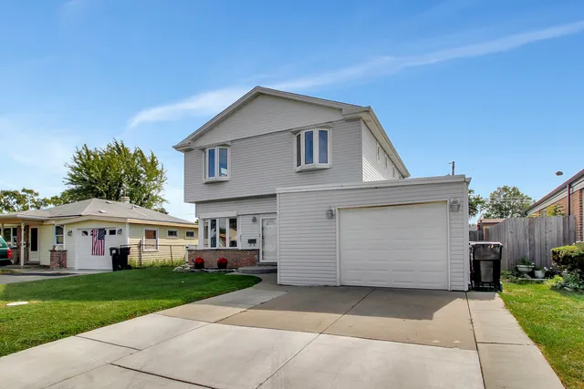 a view of house with yard